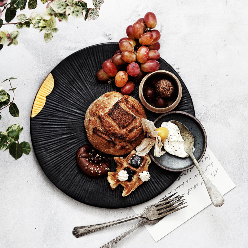 Golden Edge Noir: Textured Black Dinnerware Set with Gold Trim