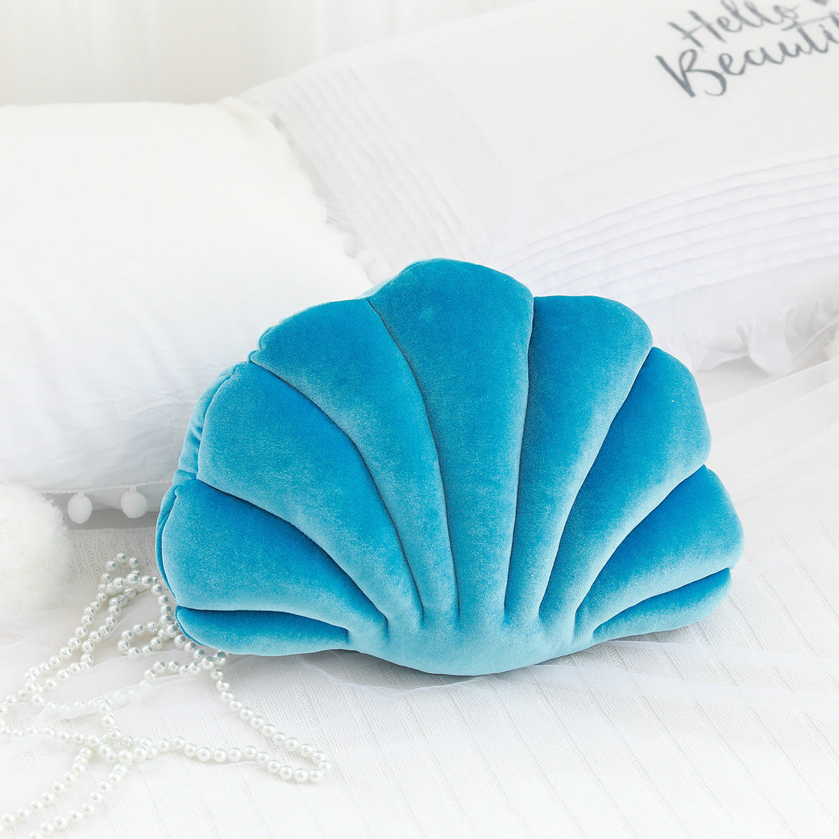 Ocean Bloom: Vibrant Shell-Shaped Cushions