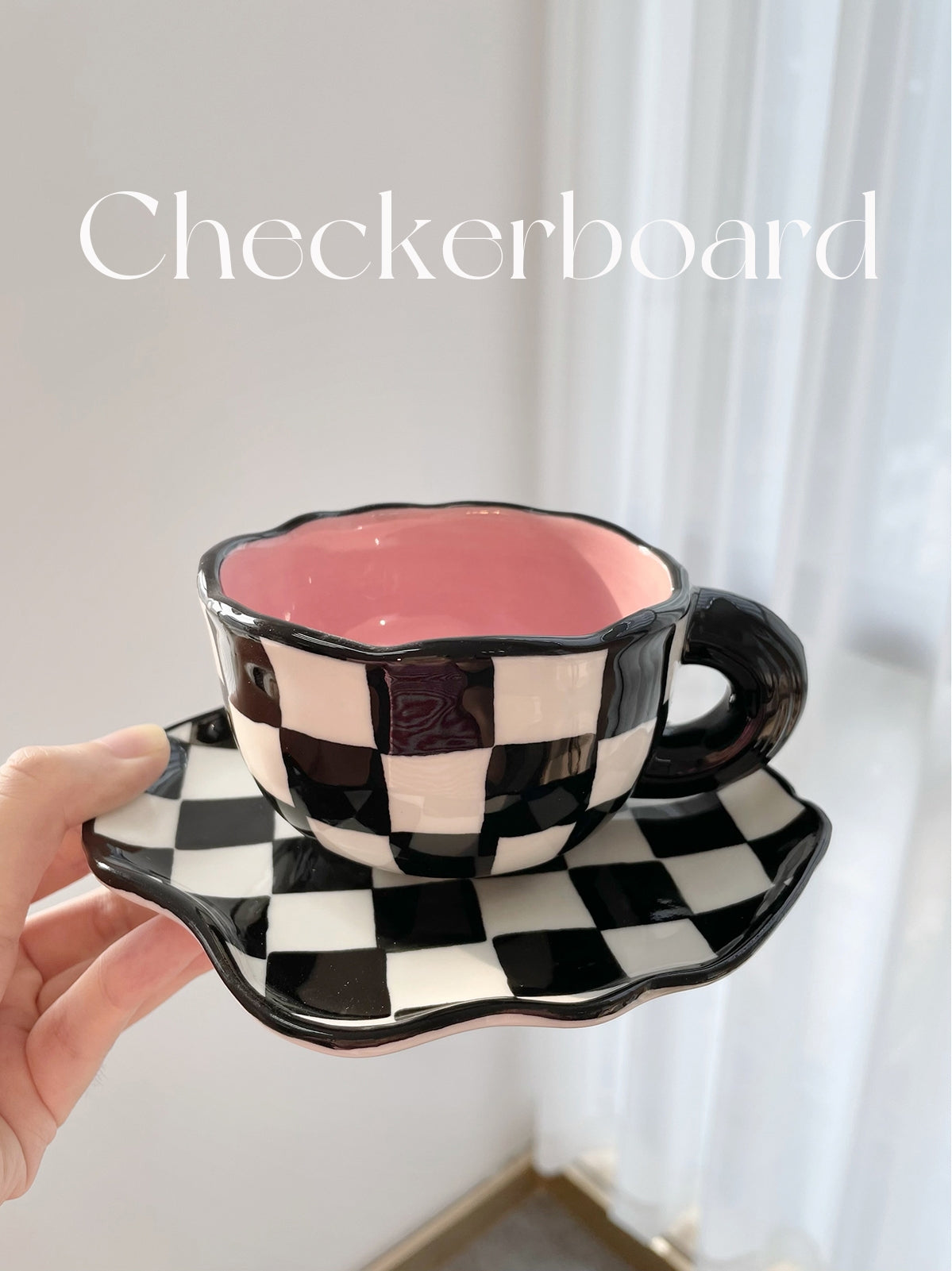 Checkerboard Charm: Black and White Mug & Saucer